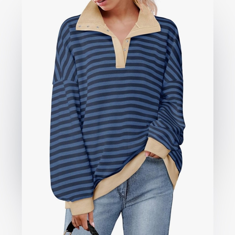Long sleeve sweatshirt with v neck collar. Size L runs a bit oversized